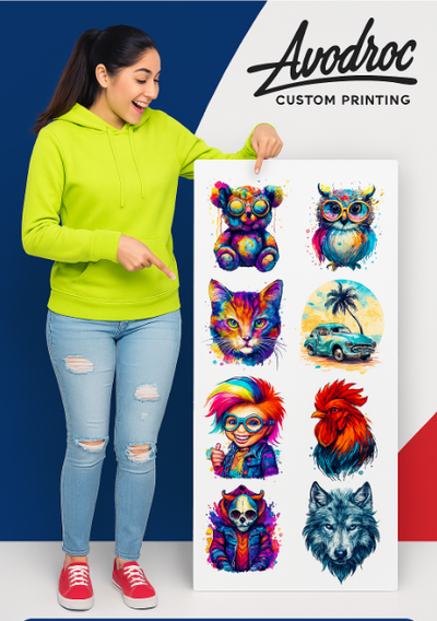 Woman in a green hoodie holding colorful DTF gang sheet designs featuring animals and a vintage car for custom printing.